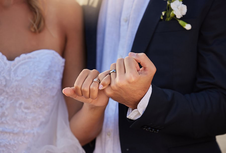 wedding rings closeup couple with pinky promise love loyalty marriage romance hands married man woman with jewellery their union bond romantic event 1